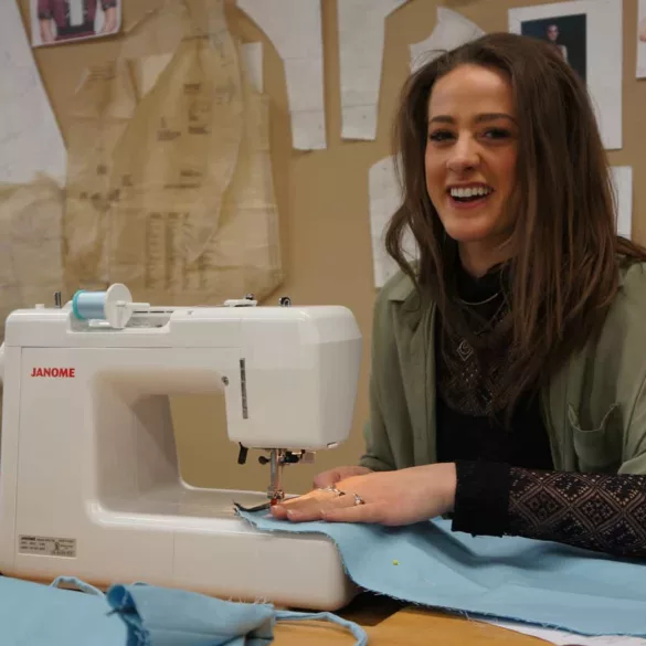 maggie barrett works a sewing machine in her class