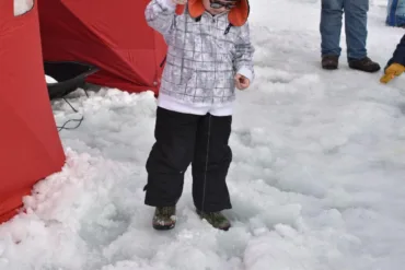 Photo of child ice fishing