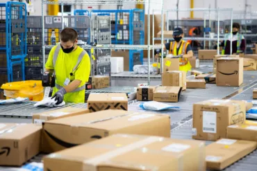 Photo of Amazon associates sorting deliveries