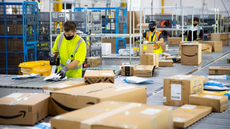 Photo of Amazon associates sorting deliveries