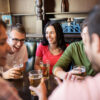 Photo of friends chatting at a pub