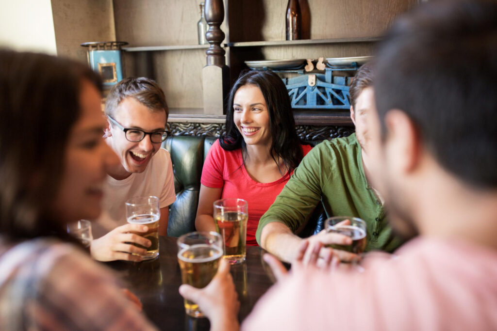 Photo of friends chatting at a pub