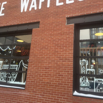 Photo of downtown window decorated for the holidays